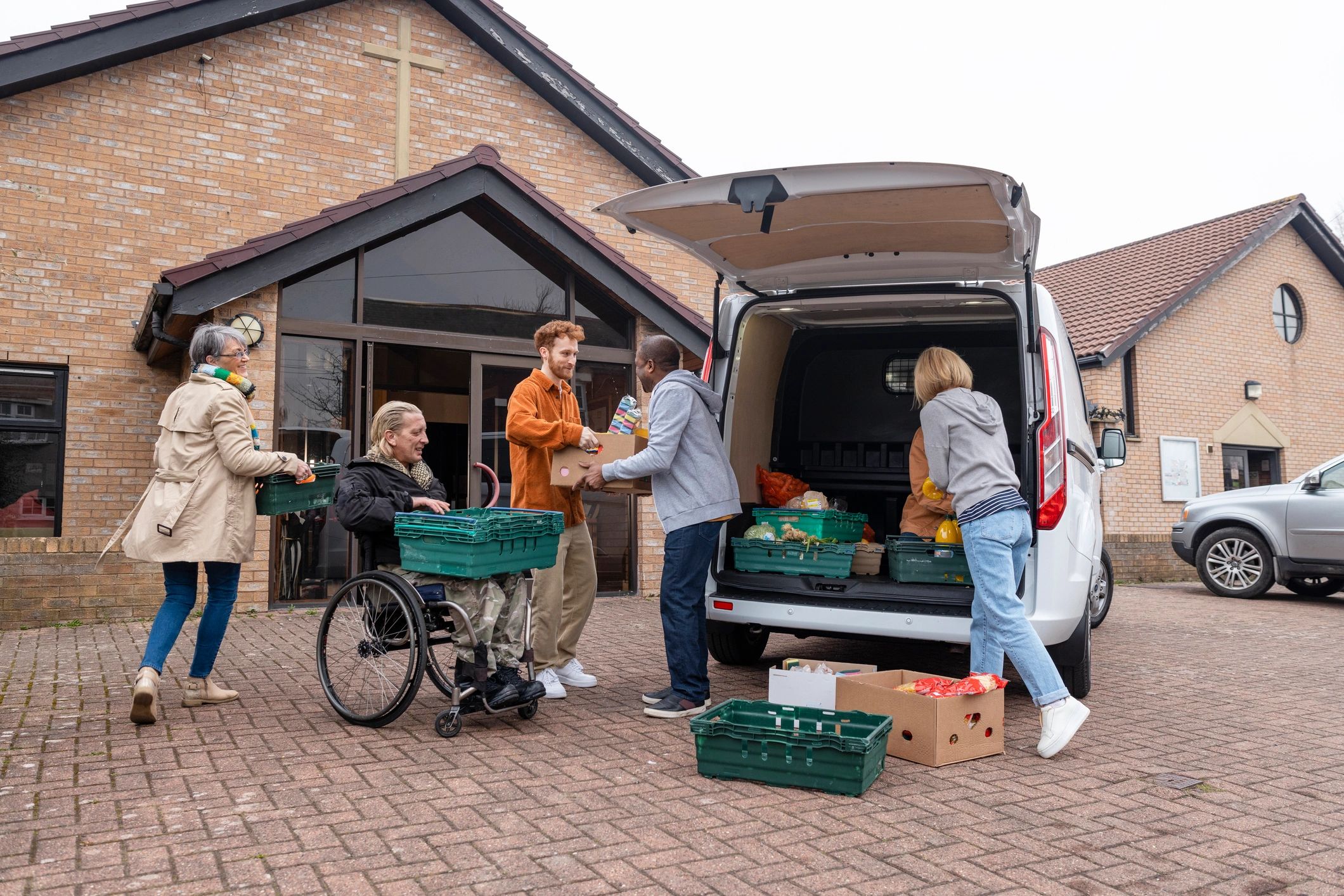 Volunteers unloading donated supplies together