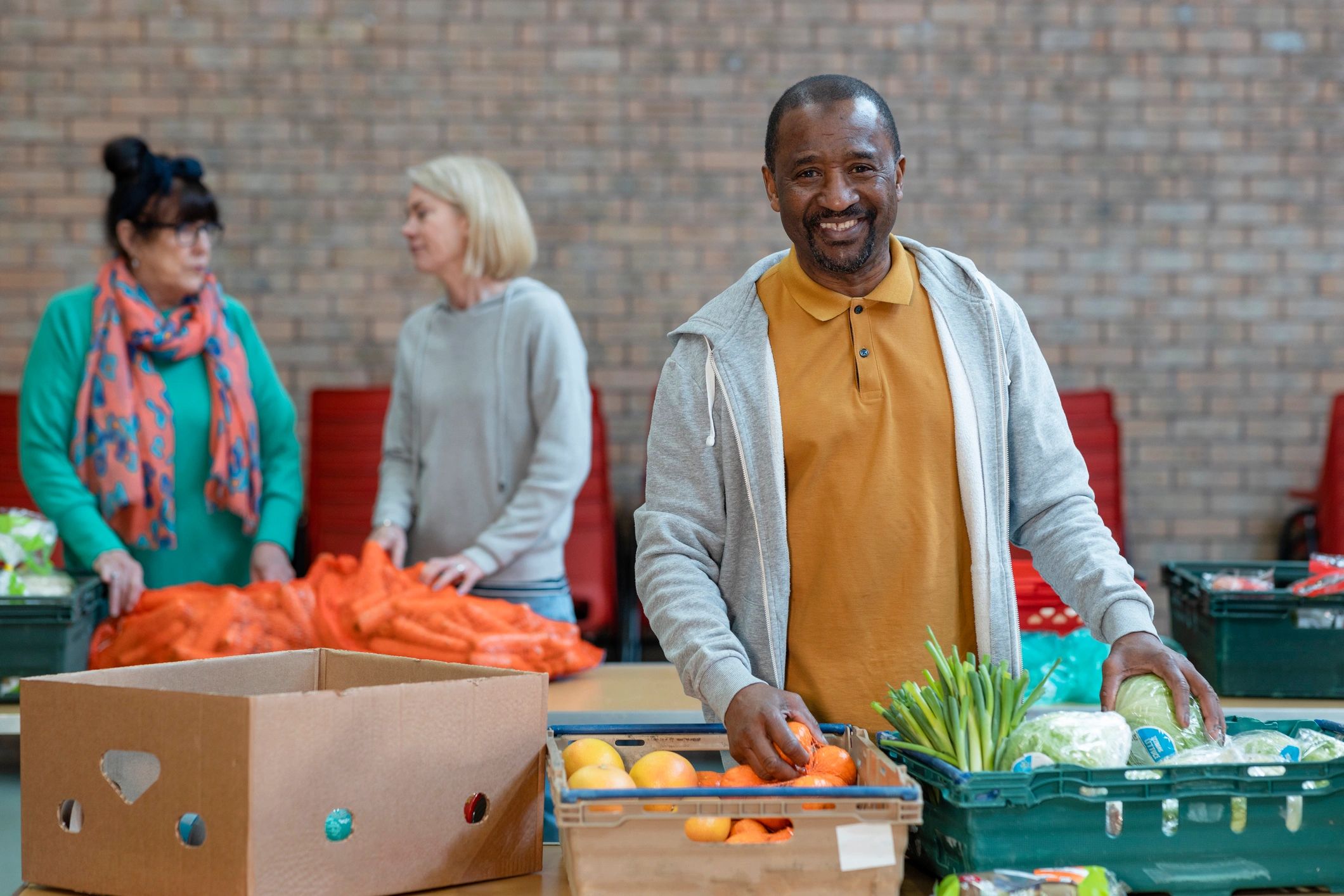 Volunteers supporting community operations indoors