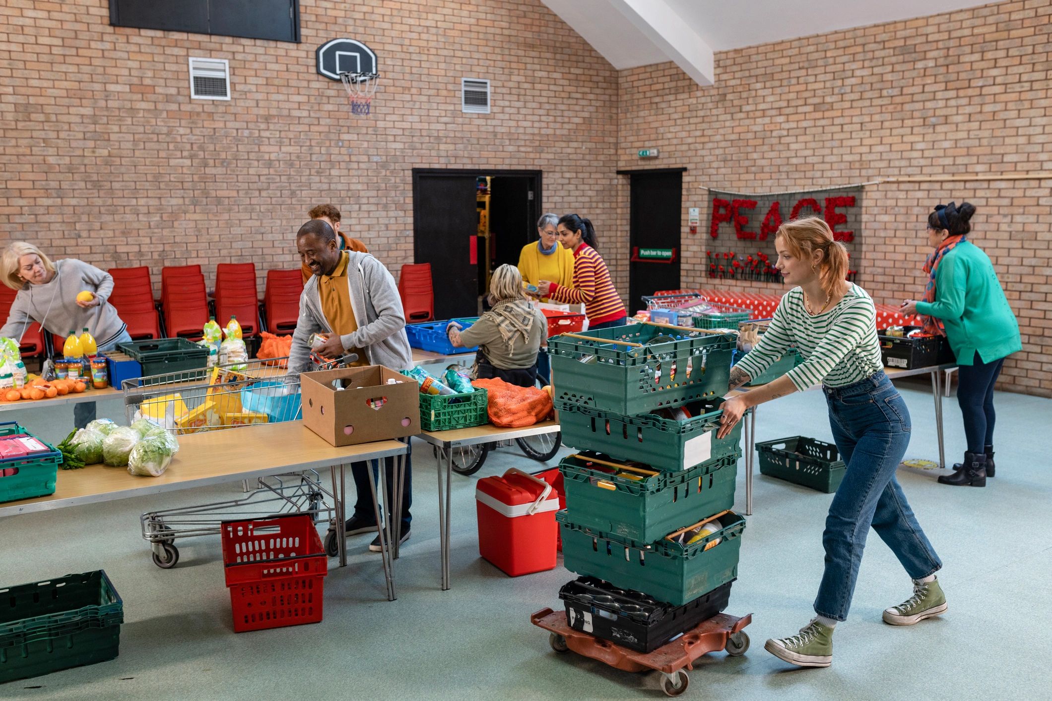 Volunteers organizing donated goods for community support
