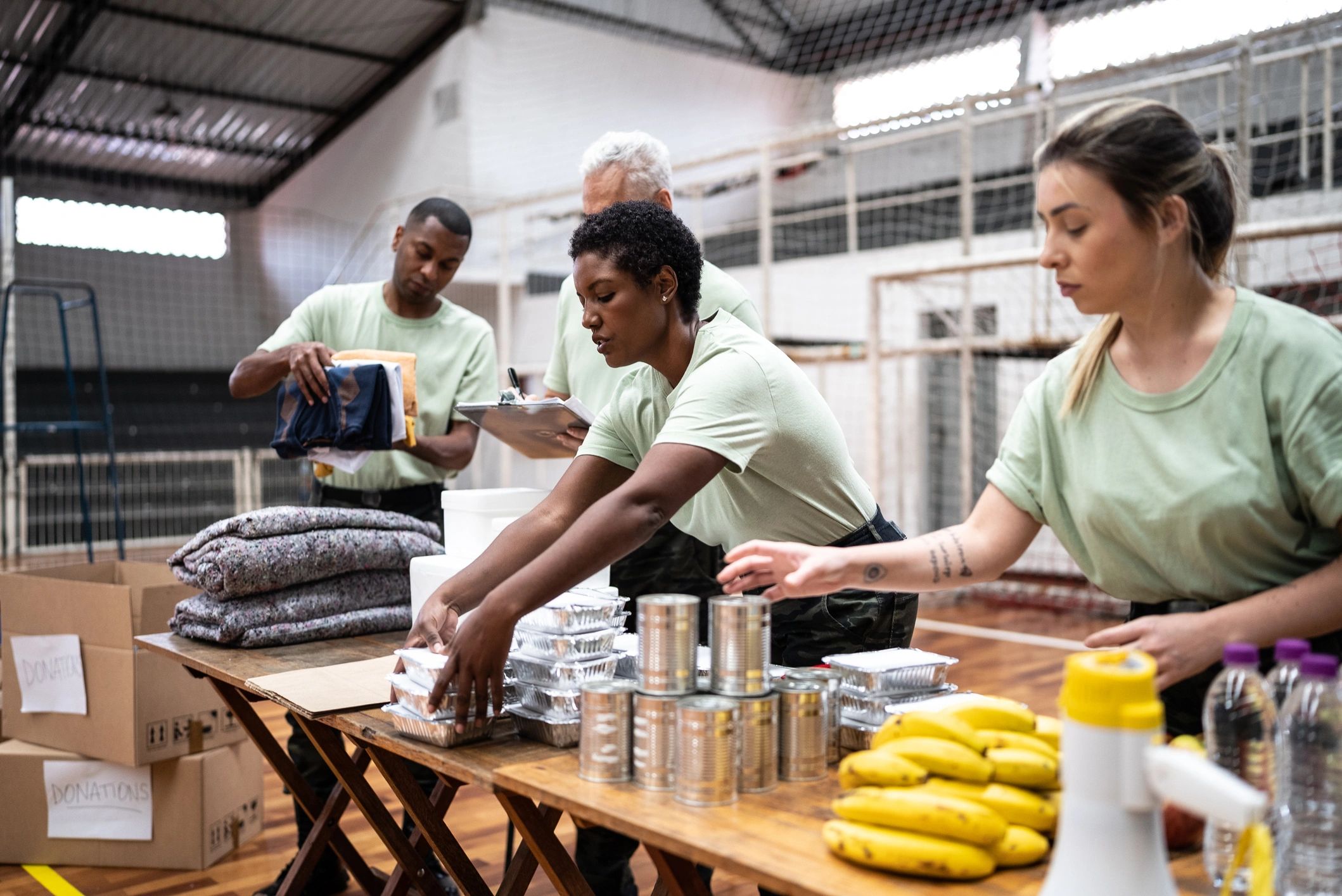 Volunteers organizing donations indoors