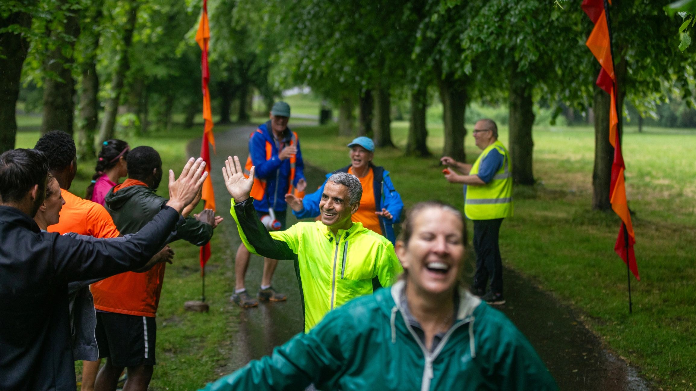 Volunteers and participants at a community event finish area