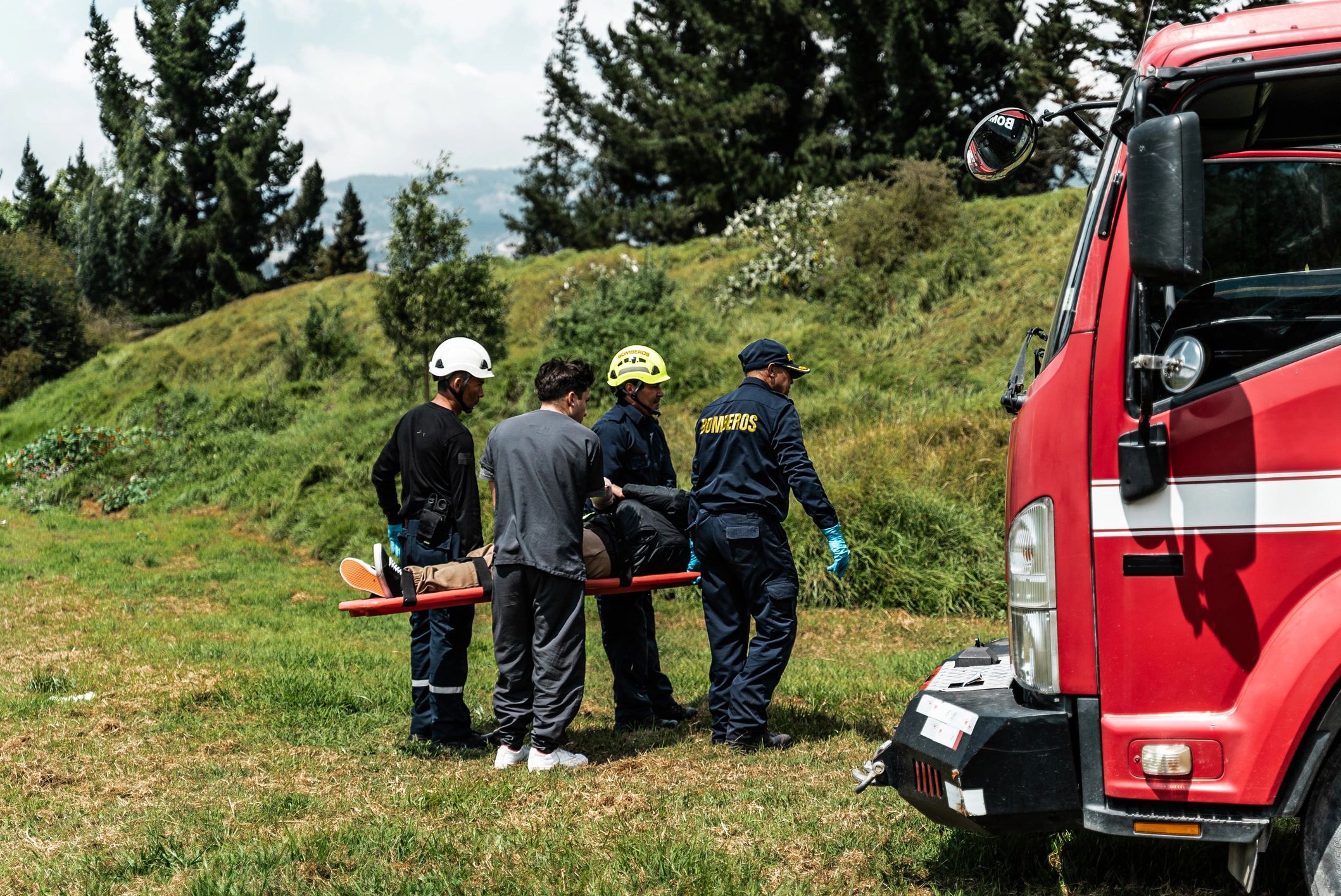 Emergency response team transporting a patient on a stretcher