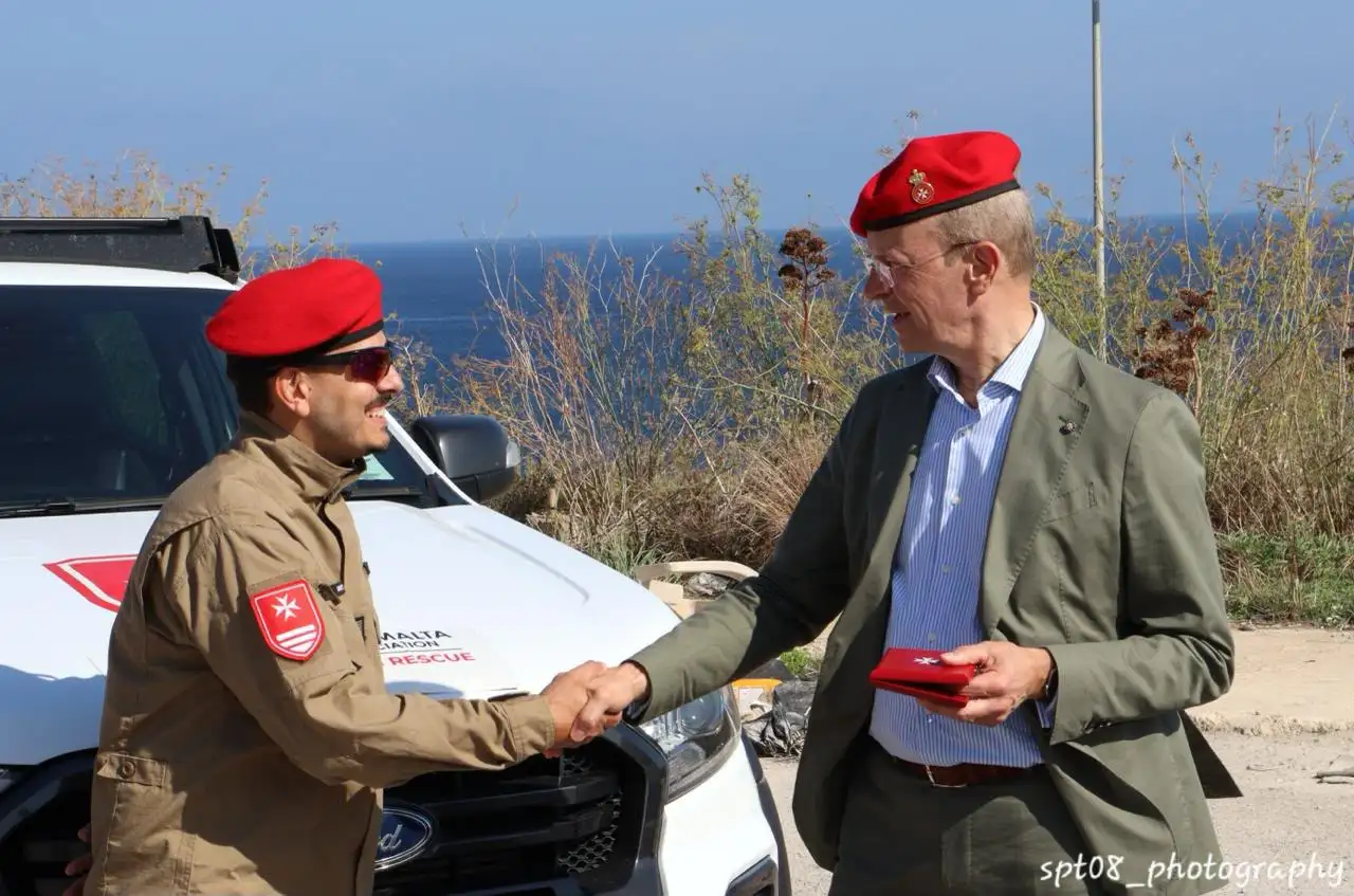 Unit Leader Simon Briffa receives a commemorative medal from H.E. the Grand Hospitaller